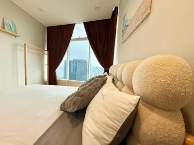 a bedroom with a large bed and a large window at Sky Suites Klcc By Stayner in Kuala Lumpur
