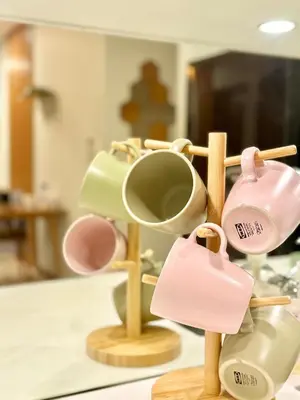 a group of cups and hats on a rack at Sky Suites Klcc By Stayner in Kuala Lumpur