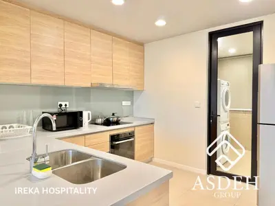 a kitchen with a sink and a refrigerator at KaMi Mont Kiara Residences & Hotel by Ireka in Kuala Lumpur