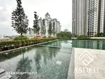 a swimming pool in a city with tall buildings at KaMi Mont Kiara Residences & Hotel by Ireka in Kuala Lumpur
