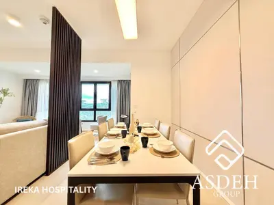 a dining room with a table and chairs at KaMi Mont Kiara Residences & Hotel by Ireka in Kuala Lumpur