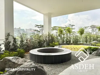 a fire pit in the middle of a garden at KaMi Mont Kiara Residences & Hotel by Ireka in Kuala Lumpur