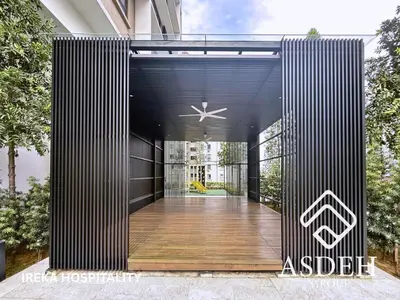an exterior view of a building with a black facade at KaMi Mont Kiara Residences & Hotel by Ireka in Kuala Lumpur