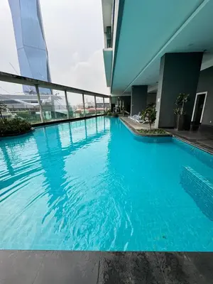 a swimming pool in the middle of a building at Casa residency by relaxhome in Kuala Lumpur