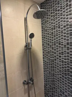 a shower with two lights and a glass door at Casa residency by relaxhome in Kuala Lumpur