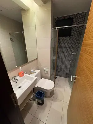 a bathroom with a toilet and a sink and a shower at Casa residency by relaxhome in Kuala Lumpur