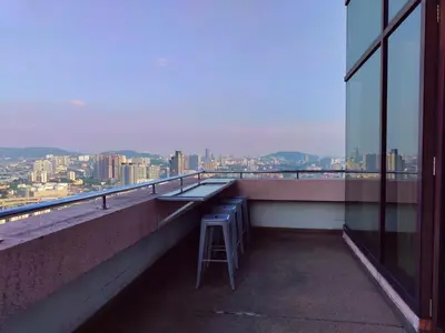 a stool sitting on the ledge of a building at Twobedroom Hotel Apartment At Times Square Kuala Lumpur in Kuala Lumpur