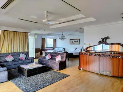 a living room with a couch and a table at Twobedroom Hotel Apartment At Times Square Kuala Lumpur in Kuala Lumpur