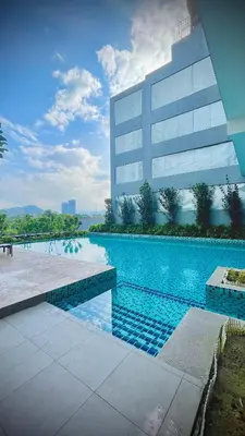 a swimming pool in front of a building at Suite16 Kuala Lumpur in Kuala Lumpur
