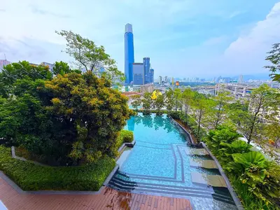 an overhead view of a swimming pool in a city at In