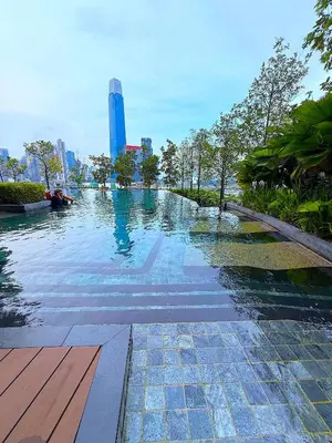 a swimming pool with a city in the background at In