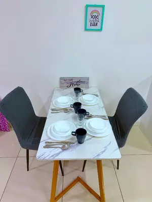 a table with plates and utensils on it at In
