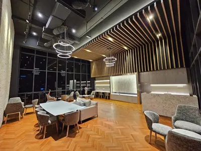 a meeting room with a table and chairs at Societe Hartamas, Mont Kiara, Kuala Lumpur Golf in Kuala Lumpur