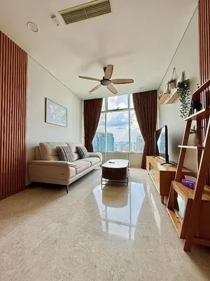a living room with a couch and a ceiling fan at Sky Suites Klcc By Stayner in Kuala Lumpur