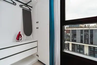 a window with a view of a city at Arcoris Mont Kiara in Kuala Lumpur