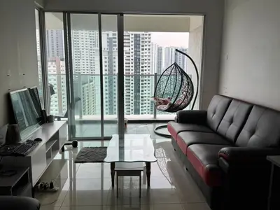 a living room with a couch and a glass table at Maxim City Lights in Kuala Lumpur