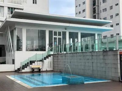 a building with a swimming pool in front of a building at Maxim City Lights in Kuala Lumpur