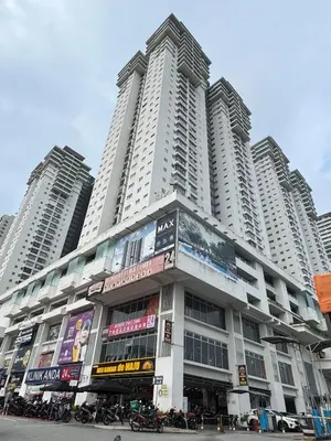a large building with tall buildings in the background at Maxim City Lights in Kuala Lumpur