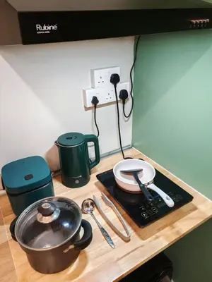 a counter top with a pot and pans on it at Sunway Velocity Two Direct Link to Sunway Velocity Mall MRT TRX in Kuala Lumpur