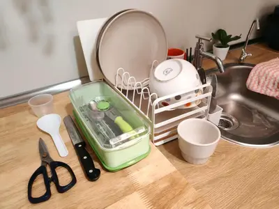 a kitchen counter with a dish drying rack next to a sink at Sunway Velocity Two Direct Link to Sunway Velocity Mall MRT TRX in Kuala Lumpur