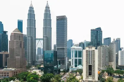 a view of a city with tall buildings at Legasi 3 Premium Bedroom With KLCC View 10min Walk to KLCC Comes With Board Games and PS4 Fit Up To 10PAX in Kuala Lumpur