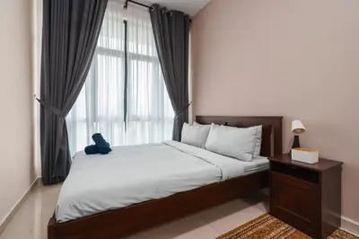 a bedroom with a bed with a large window at Legasi 3 Premium Bedroom With KLCC View 10min Walk to KLCC Comes With Board Games and PS4 Fit Up To 10PAX in Kuala Lumpur