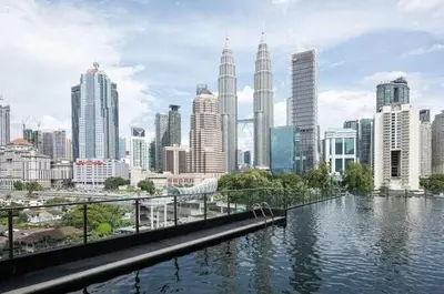 a view of a city with a river and buildings at Legasi 3 Premium Bedroom With KLCC View 10min Walk to KLCC Comes With Board Games and PS4 Fit Up To 10PAX in Kuala Lumpur