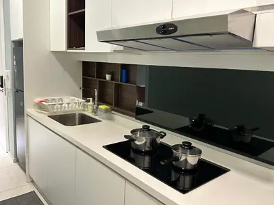 a kitchen with two pots on top of a stove at The Robertson Bukit Bintang in Kuala Lumpur