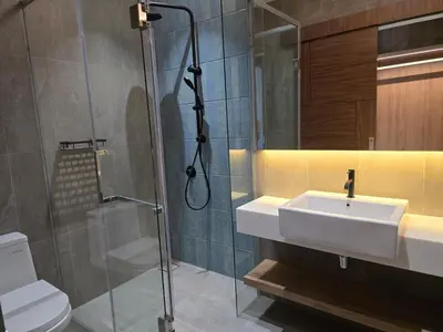 a bathroom with a sink and a shower and a toilet at MidValley Bangsar Stylish Suite by DingDing in Kuala Lumpur