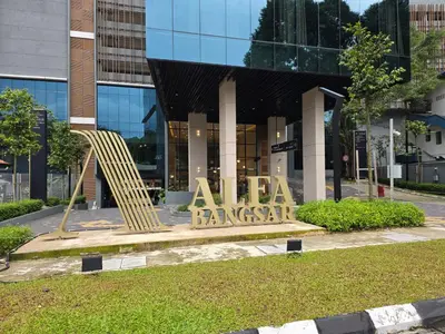 a large sign in front of a building at MidValley Bangsar Stylish Suite by DingDing in Kuala Lumpur