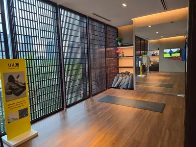 a gym with yoga mats in a room with windows at MidValley Bangsar Stylish Suite by DingDing in Kuala Lumpur