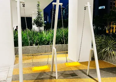 a couple of swings in front of a church at The Luxury Quill Residence KLCC By Tasrifa in Kuala Lumpur