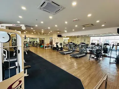 a gym with treadmills and cardio equipment in a building at DYNAMIC SUITES by TIMES SQUARE KL in Kuala Lumpur