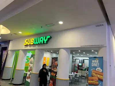 a person standing in front of a store at DYNAMIC SUITES by TIMES SQUARE KL in Kuala Lumpur