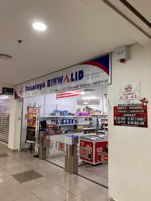 a grocery store with a sign on the wall at Legasi Kg Bharu with KLCC view near LRT Station in Kuala Lumpur