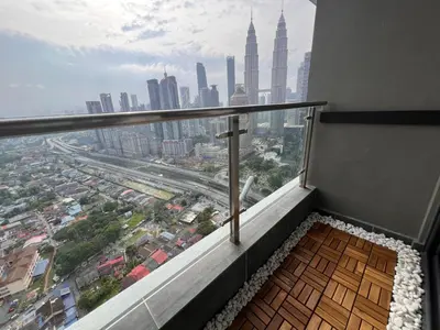 a balcony with a view of a city at Legasi Kg Bharu with KLCC view near LRT Station in Kuala Lumpur