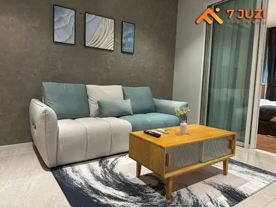 a living room with a couch and a coffee table at Luxury and Cozy Suite KL and 118 TOWER View Netflix 1080HD in Kuala Lumpur