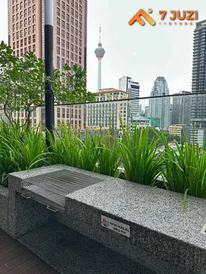 a stone bench with a view of a city at Luxury and Cozy Suite KL and 118 TOWER View Netflix 1080HD in Kuala Lumpur