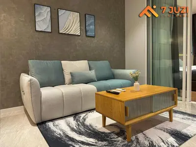 a living room with a couch and a coffee table at Luxury and Cozy Suite KL and 118 TOWER View Netflix 1080HD in Kuala Lumpur