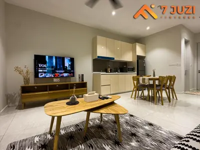 a living room with a table and a tv and a kitchen at 2BED Luxury Cozy Suite 118TOWER view with NetflixHD1080 in Kuala Lumpur