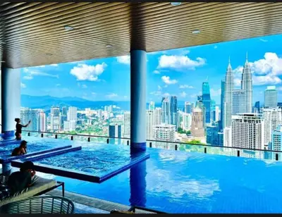 a swimming pool with a view of the city at Dreamy Destiny Suites At KLCC Swimming Pool View in Kuala Lumpur