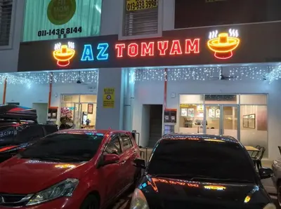 a row of cars parked in front of a car show at Modern and Comforts RC Residence Fully Aircond in Kuala Lumpur