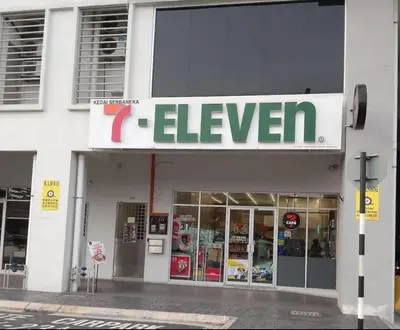a store with a sign on the side of a building at Modern and Comforts RC Residence Fully Aircond in Kuala Lumpur