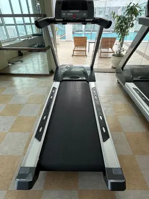 a treadmill in the middle of a room at Park view Apartment near klcc in Kuala Lumpur