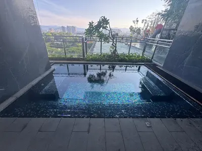 a small pool of water on the floor of a building at Expressionz KLCC By Laze Home in Kuala Lumpur