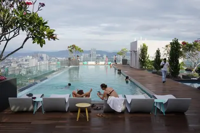 a group of people in a swimming pool on a building at Riveria City Kuala Lumpur By Nest Suites in Kuala Lumpur