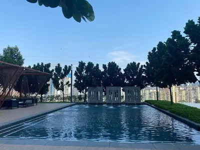 a swimming pool in the middle of a city at Sydney Sunset 3BR M Vertica Near MRT by RumaBnB in Kuala Lumpur