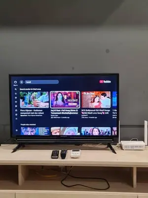 a flat screen tv sitting on top of a table at Parkview Family Suite klcc with views in Kuala Lumpur