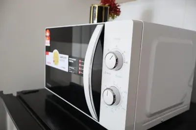 a microwave oven sitting on top of a counter at Cozy kenwingston platz kl 2-5pax 2BR&2BR Klcc view free paikin wifi1907 in Kuala Lumpur