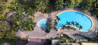 an overhead view of a pool at a resort at X'Apartelle near Pusat Bandar Damansara MRT in Kuala Lumpur